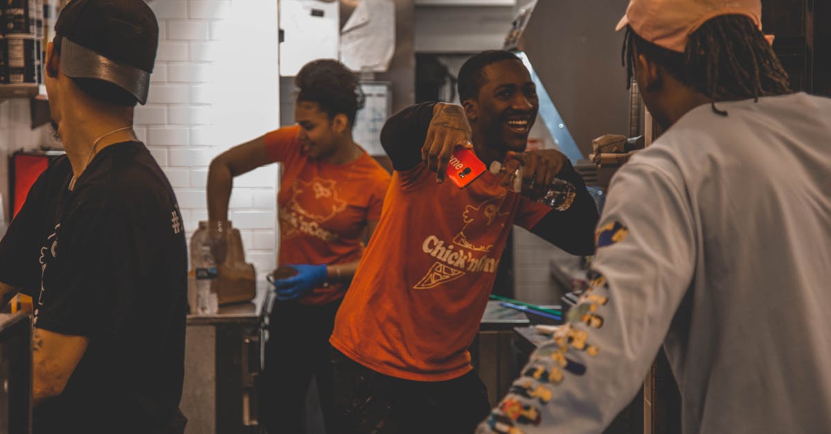 Energetic restaurant staff working together in a kitchen, showing teamwork and joy