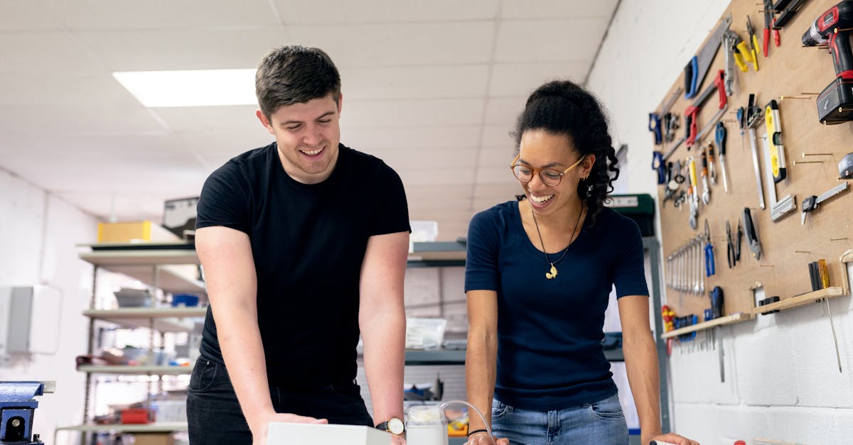 Two engineers collaborate in a workshop, engaging in hands-on prototyping and design